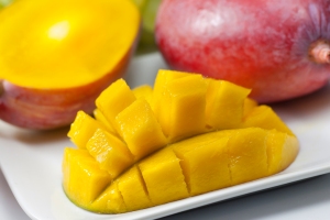 A mango half, scored and inverted.