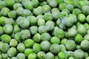 Close-up of frozen green peas.
